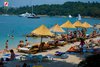 Rovinj Lone Beach umbrellas